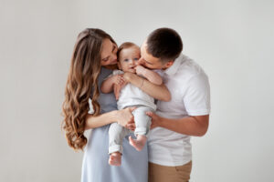 A couple holding their baby, achieved through IVF with the help of AI machine learning | RSC of The San Francisco Bay Area