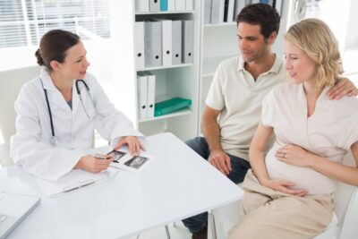 doctor talking with fertility patients who are expecting | Reproductive Science Center of the San Francisco Bay Area