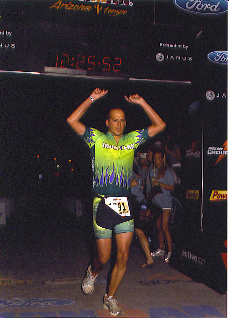 Christophe Job crosses the finish line at the Ironman Triathlon